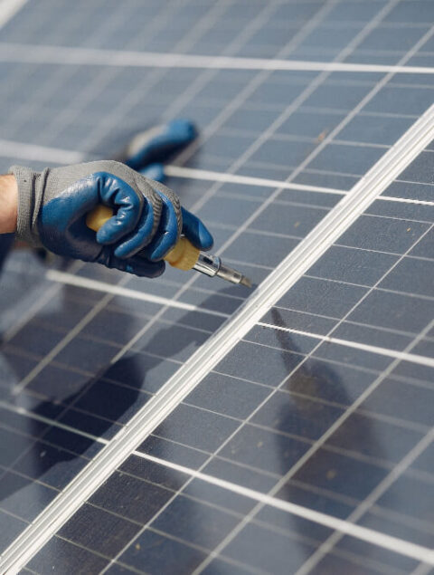 man-with-white-helmet-near-solar-panel (1)